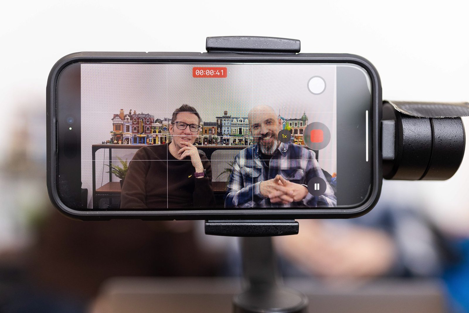 James and Garry filming on a phone