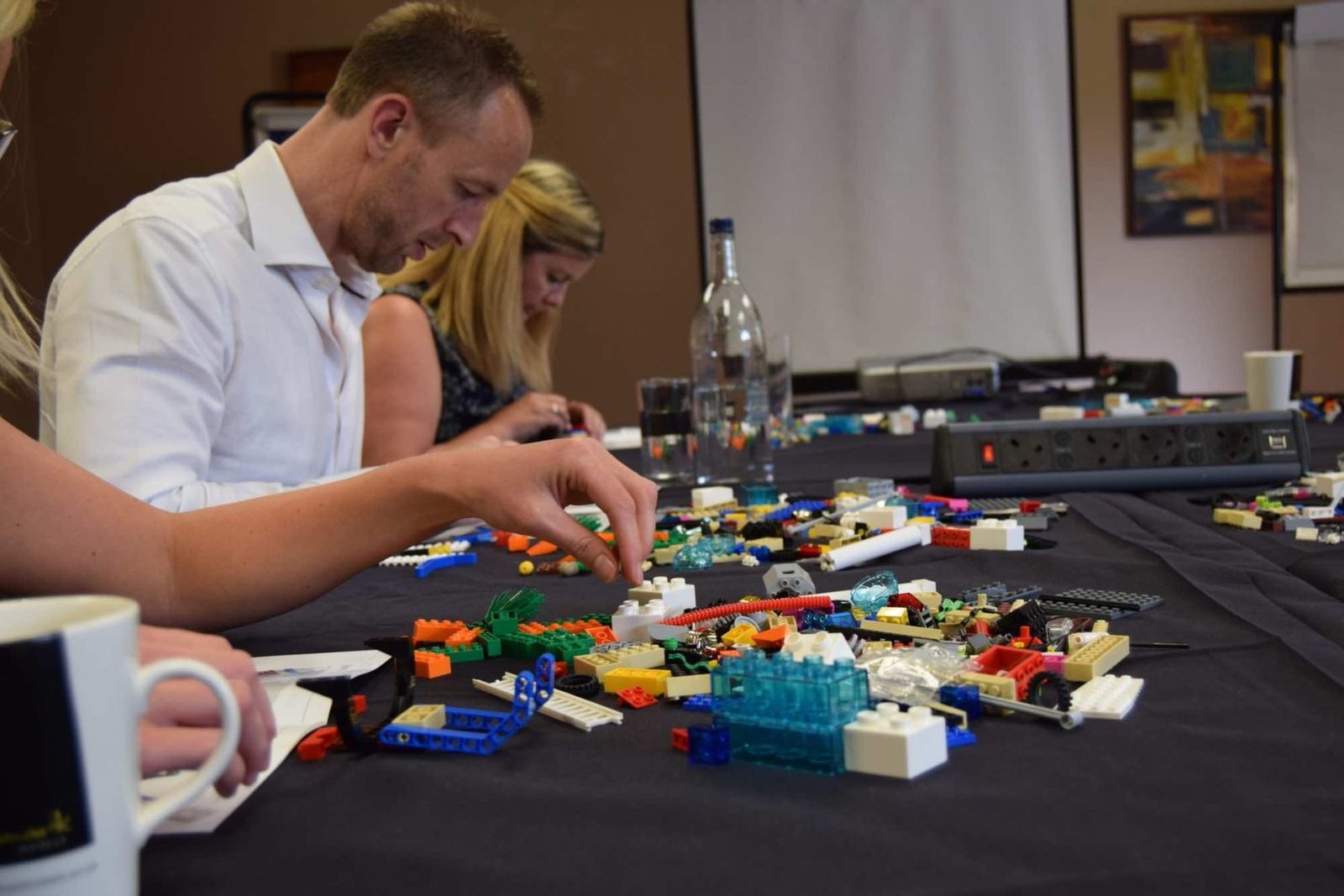 A team building LEGO models during a LEGO Serious Play session